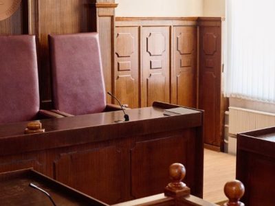 Empty BC Court of Appeal courtroom with three judges' chairs and dark wood panelling, representing the appellate process in British Columbia.